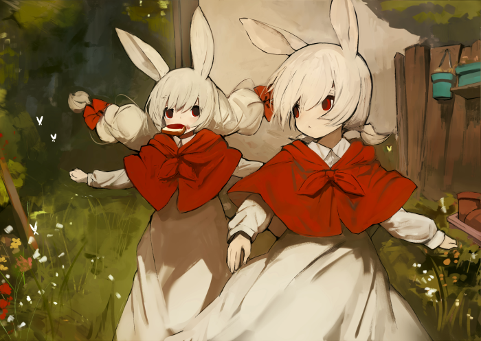 Two rabbit-eared girls in red capes eating snacks