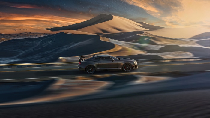 Chevrolet Camaro ZL1 driving through desert dunes