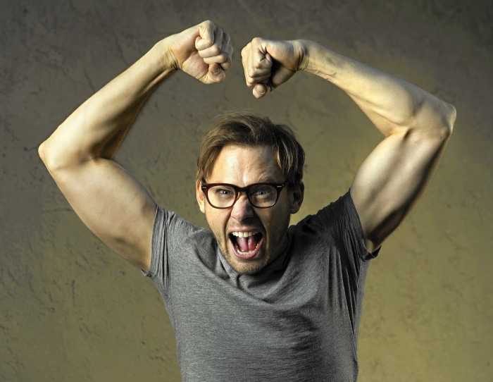 Jimmi Simpson flexing his muscles