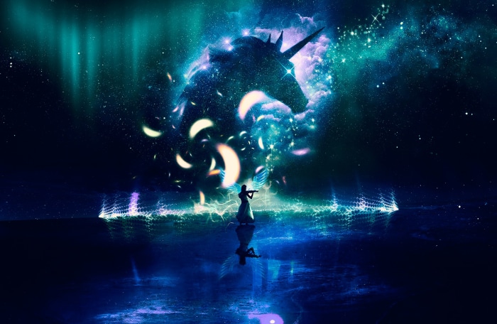 Unicorn silhouette in a starry sky with aurora