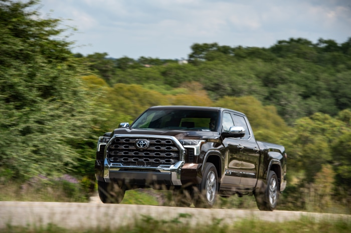 Brown Toyota Tundra CrewMax 1794 Edition driving