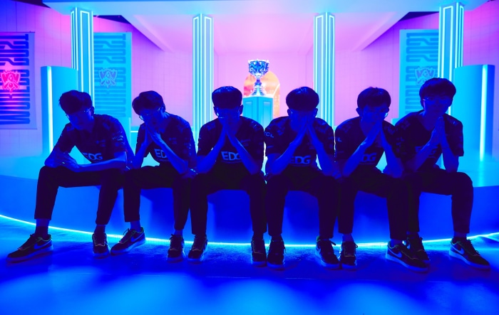 Edward Gaming team sitting with hands clasped