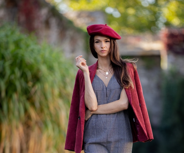 Woman wearing a red beret and coat