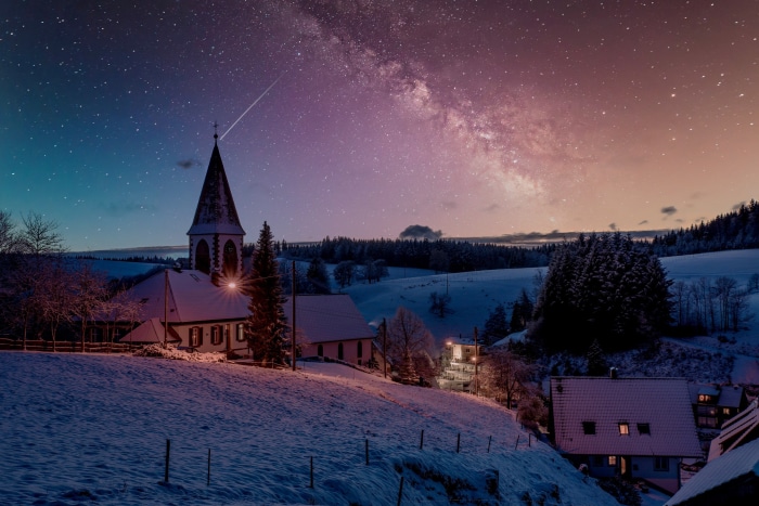 Winter Village at Night with Milky Way and Shooting Star