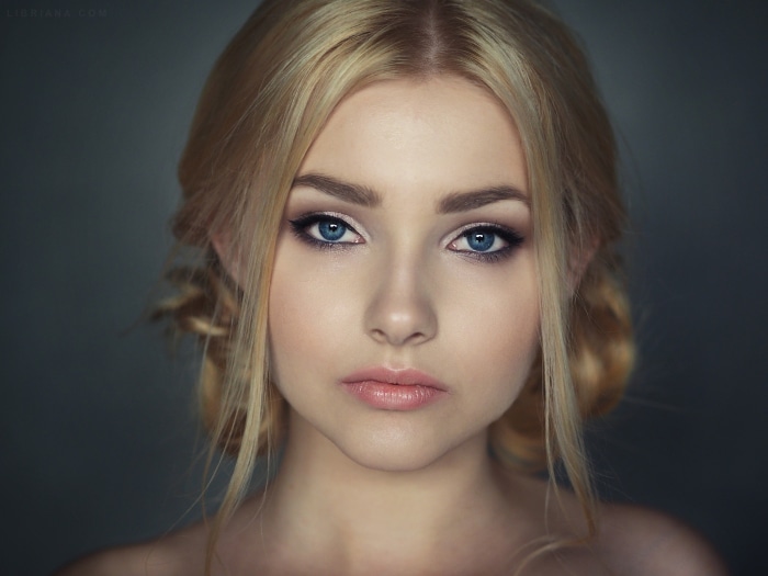 Woman with blonde hair and blue eyes
