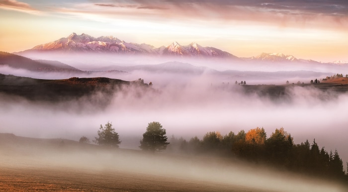 Misty mountain landscape at sunrise