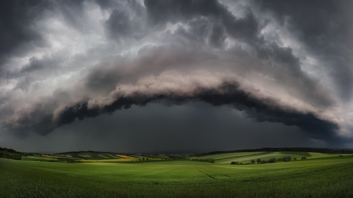 Stormy clouds over a green landscape