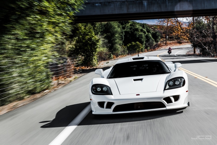 White Saleen S7 supercar driving on a road
