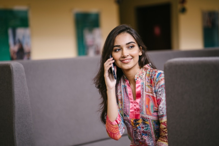 Brunette woman talking on a cell phone