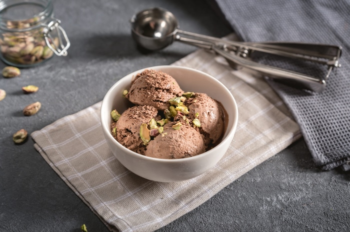 Chocolate ice cream with pistachios and chocolate shavings