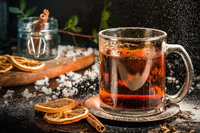 Hot tea with cinnamon and dried oranges