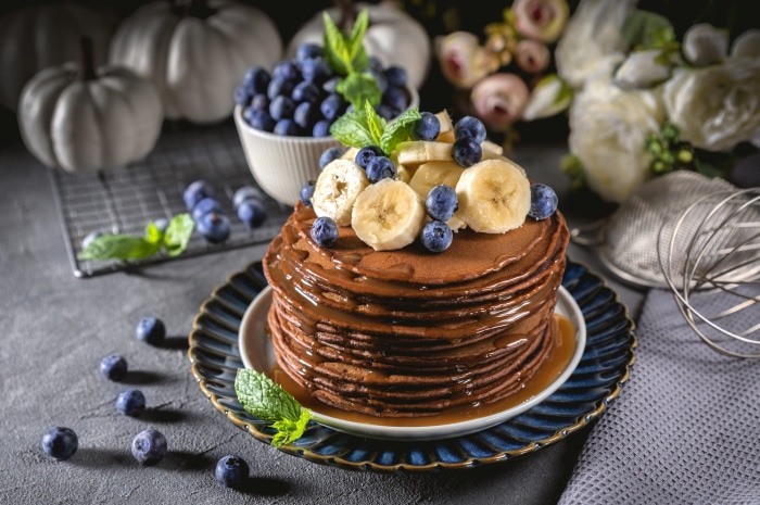 Chocolate pancakes with blueberries and bananas