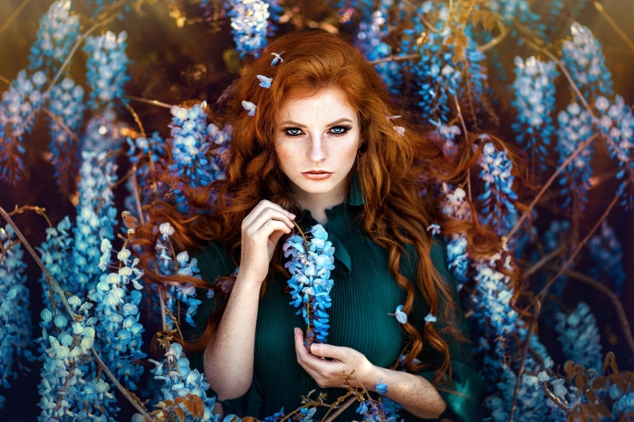 Redhead woman with blue flowers