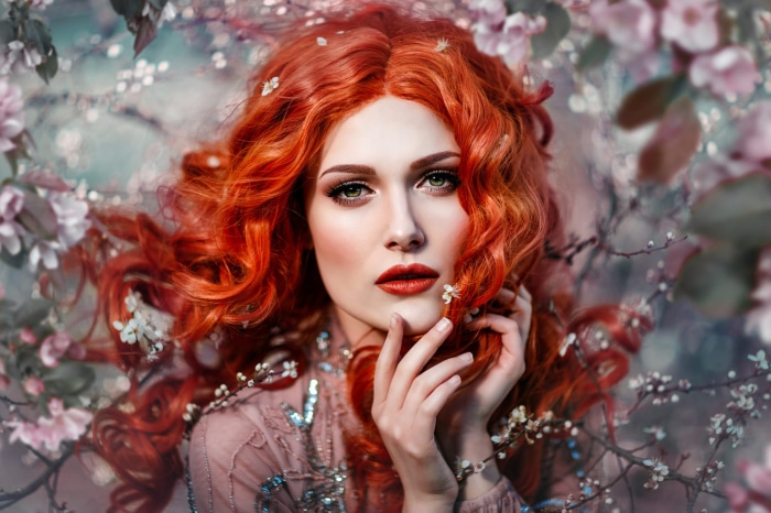 Redhead woman with red lipstick and flowers