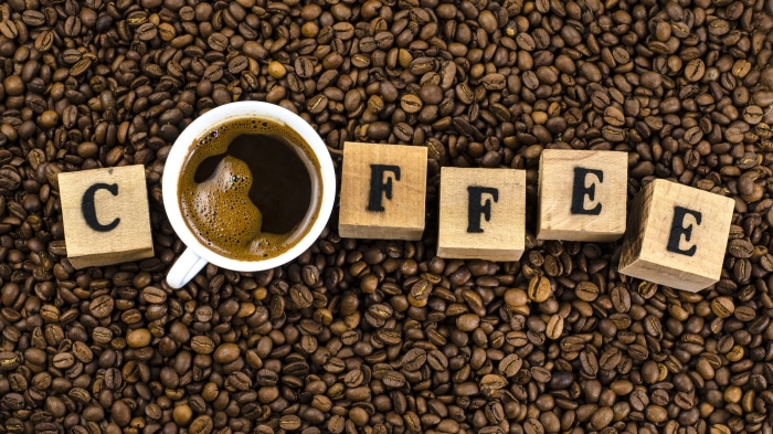 Coffee cup and wooden blocks spelling COFFEE