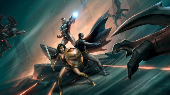 Batman, Wonder Woman, and Cyborg fighting monsters