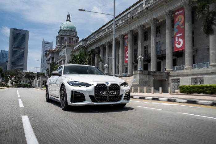 White BMW M440i xDrive Gran Coupé driving in Singapore