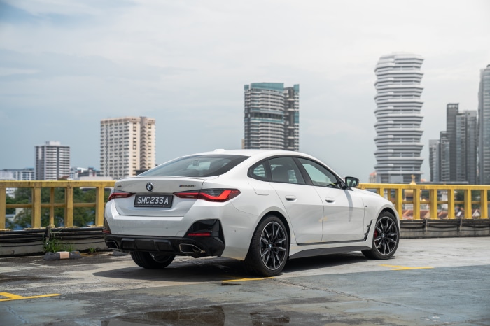 White BMW M440i xDrive Gran Coupé on a rooftop