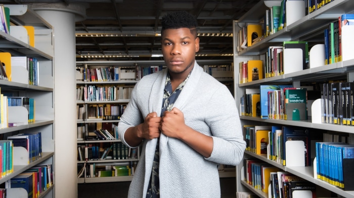 John Boyega in a library