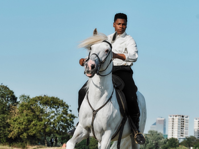 John Boyega on a white horse