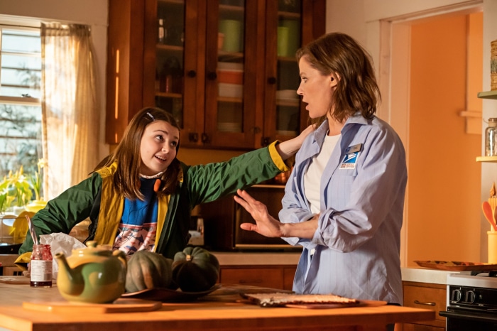 Girl and woman in kitchen