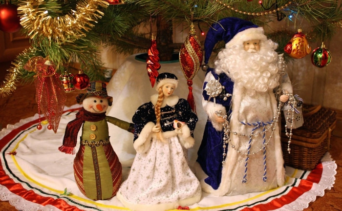 Christmas tree with Santa, Snowman, and Snow Maiden figures