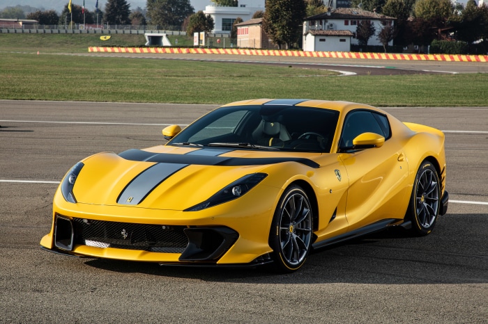 Yellow Ferrari 812 Competizione on a Racetrack
