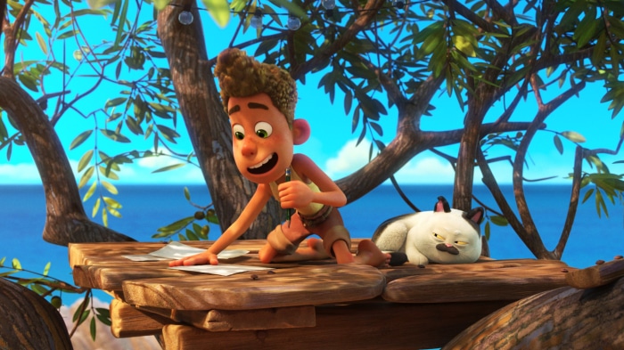 Luca and a cat on a wooden platform