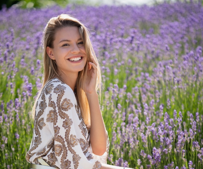 Young woman smiling in a lavender field