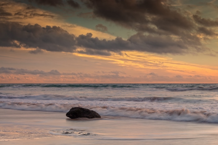 Ocean Sunset with Rock and Waves