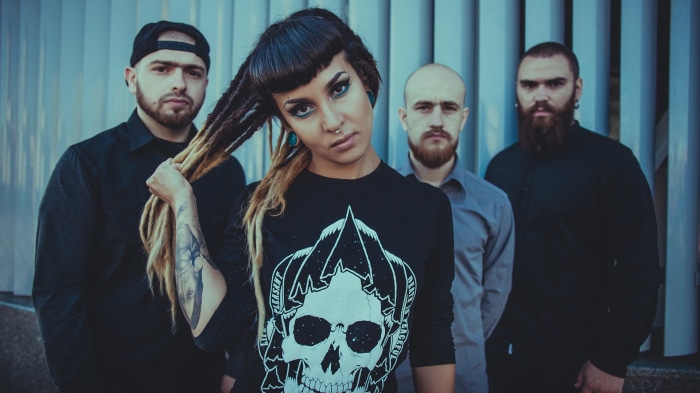 Tatiana Shmailyuk with Jinjer band members