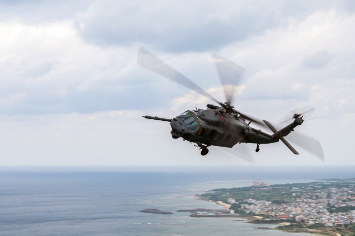 Sikorsky HH-60 Pave Hawk helicopter flying over coast