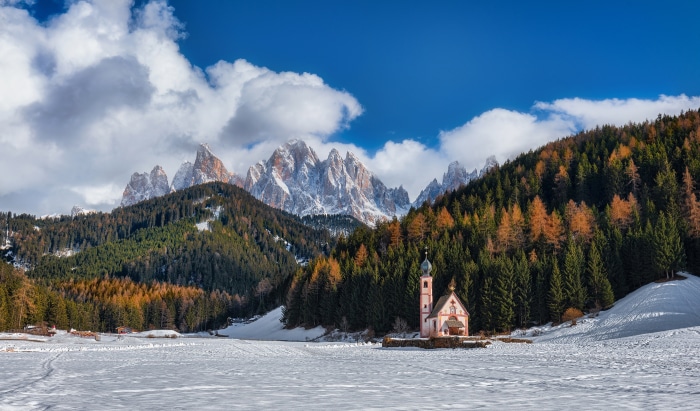 Church in the Alps with Snow and Autumn Trees