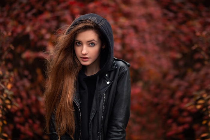 Redhead woman in leather jacket and hoodie
