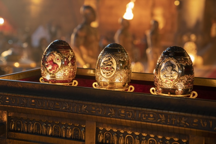 Three jeweled eggs on a golden sarcophagus