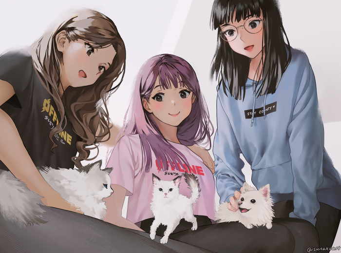 Three girls with cats and a dog