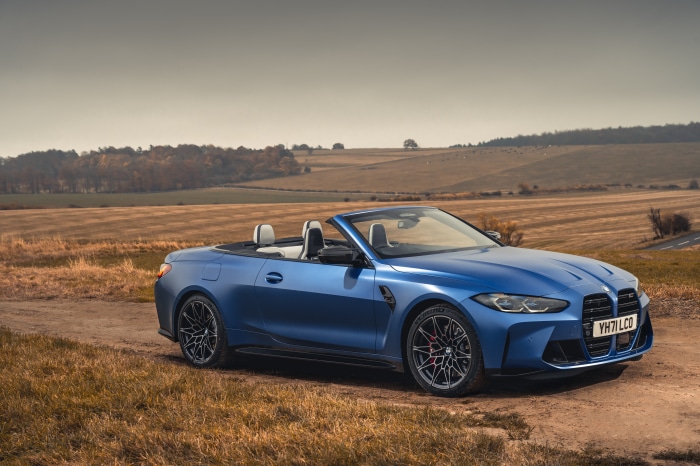 Blue BMW M4 Competition Convertible in a Field