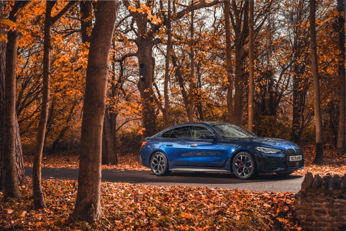 Blue BMW 420i Gran Coupé M Sport in Autumn Forest