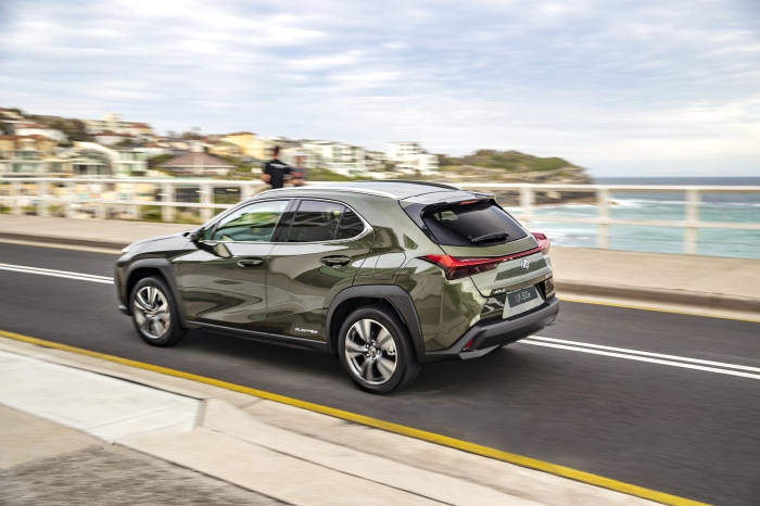 Lexus UX 300e driving on coastal road