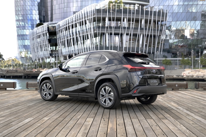 Black Lexus UX 300e parked on a wooden pier
