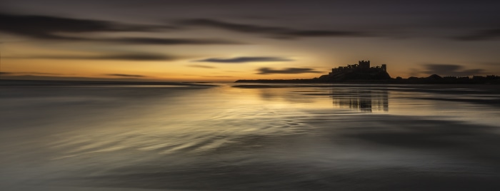 Bamburgh Castle at Dawn on Northumberland Beach