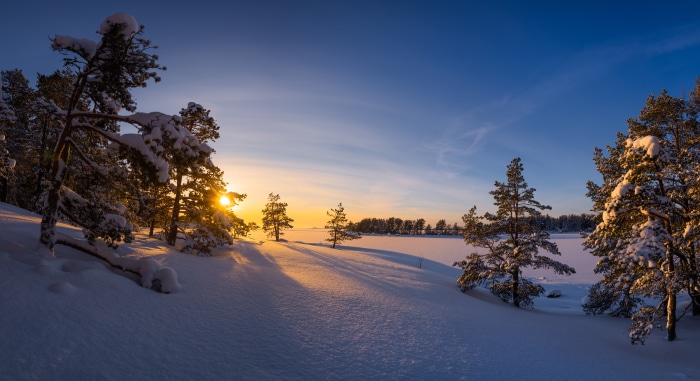 Sunset over a snow-covered landscape in Finland