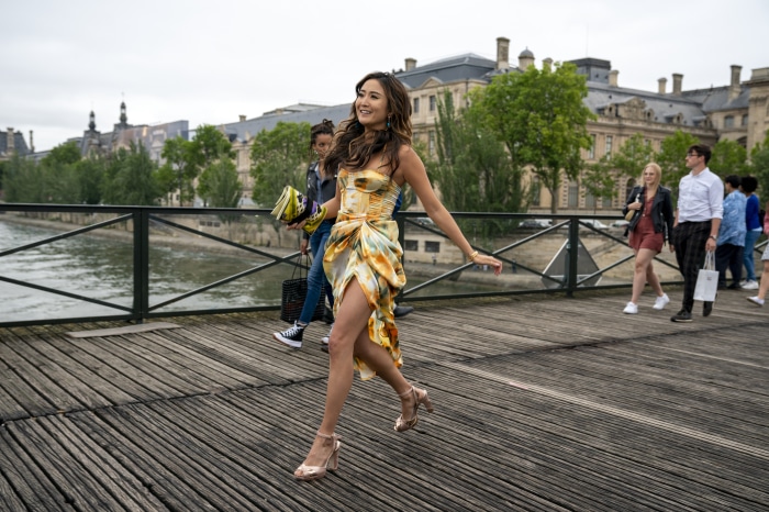 Mindy Chen from Emily in Paris on a bridge