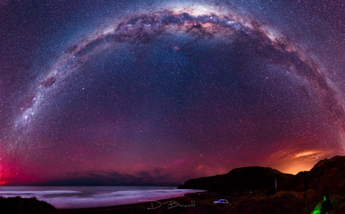 Milky Way Arching Over Coastal Landscape at Night