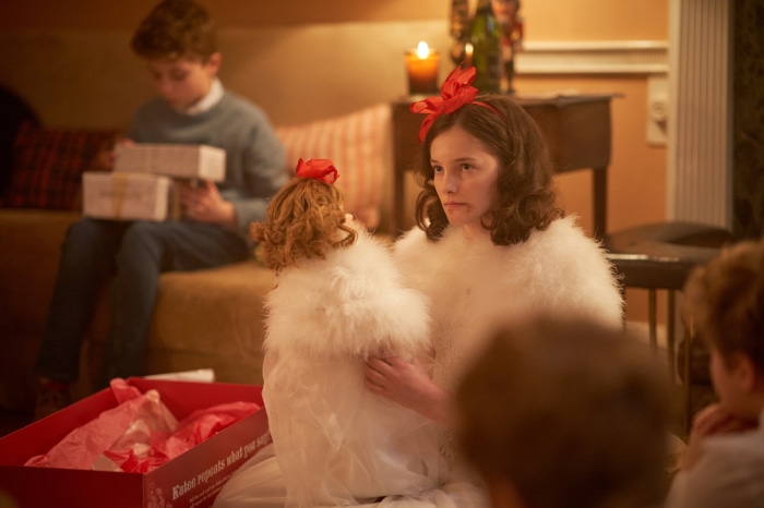 Girl with doll and boy with gifts