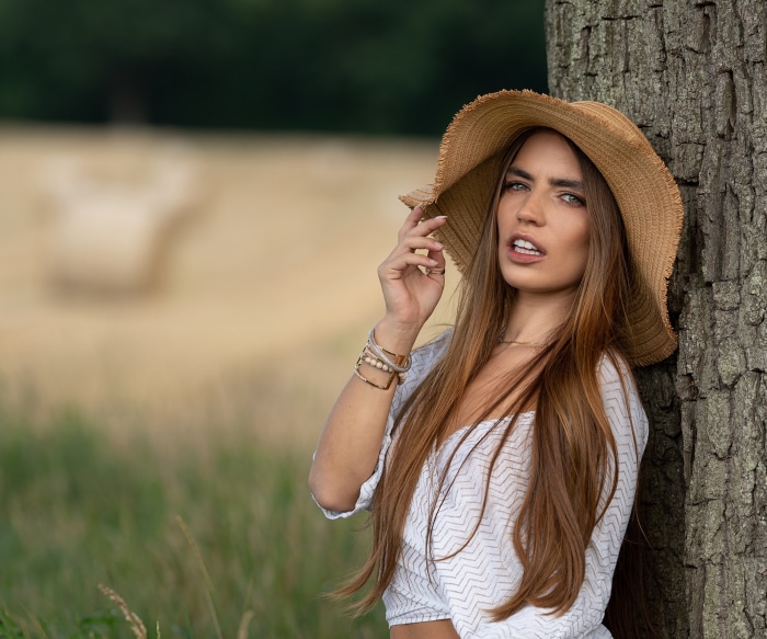 Lily Gilbert leaning against a tree