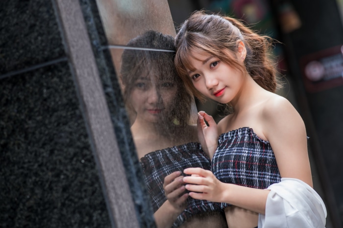Asian Woman Posing with Reflection in