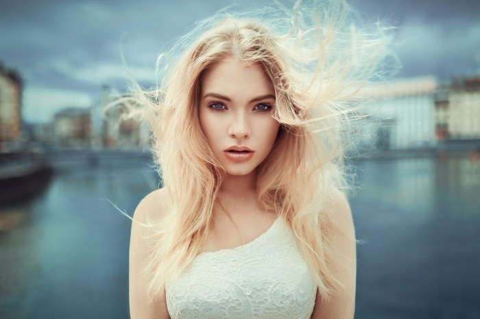 Woman with blonde hair in white dress