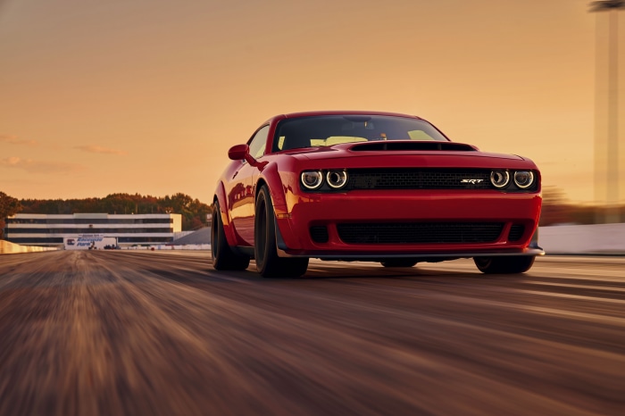 Red Dodge Challenger SRT on a race track