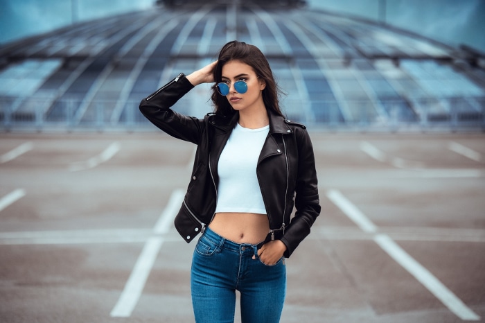 Laura Theresa wearing a leather jacket and sunglasses